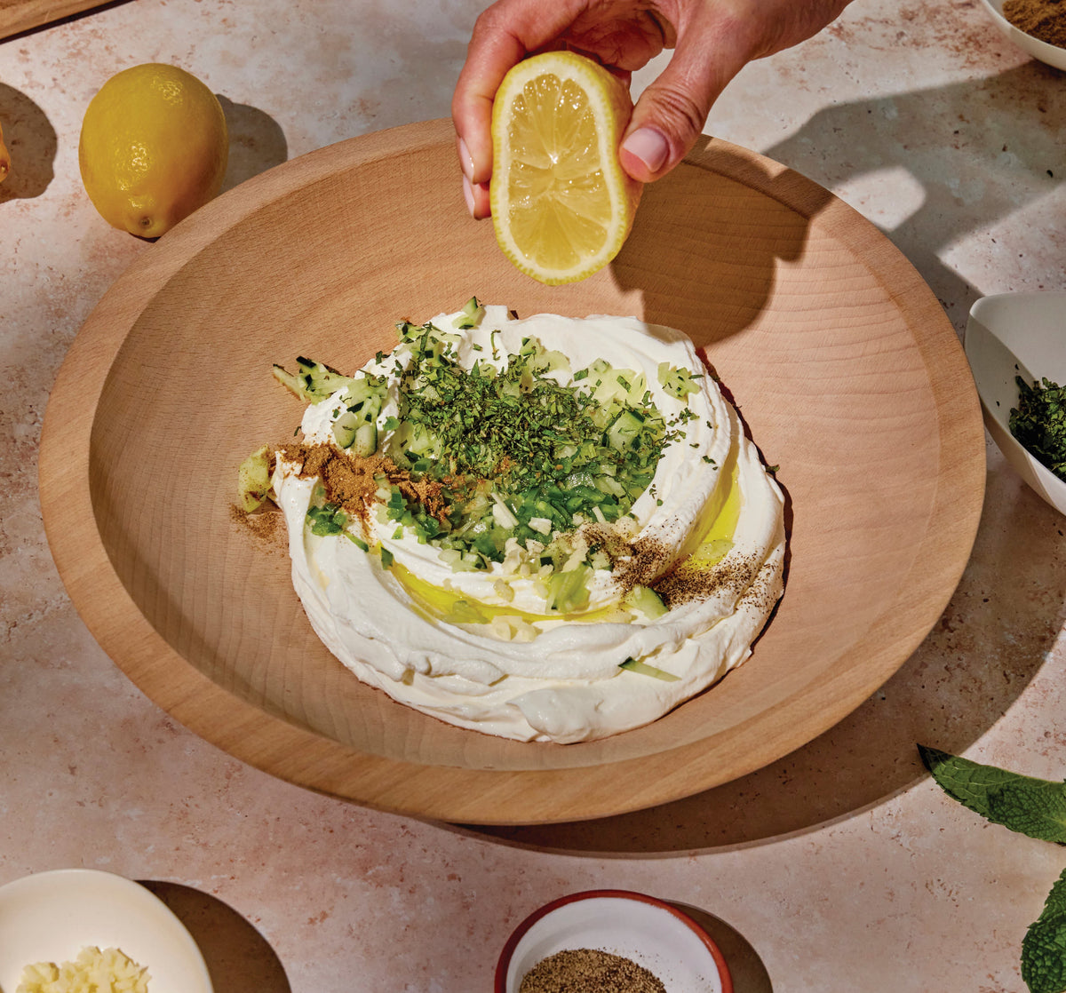 our tzatziki being created from scratch. You can use a gift card for any of our taim food.